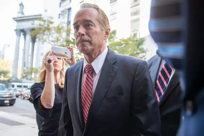 Former U.S. Rep. Chris Collins arrives in federal court on Tuesday